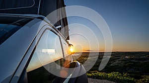 Transporter Camping Van bus at the California Ocean in the coastal Nature