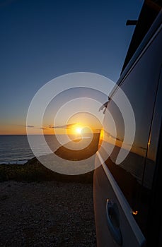 Transporter Camping Van bus at the California Ocean in the coastal Nature