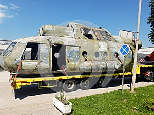 Transporting an old helicopter on a truck