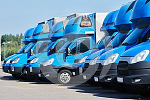 Transporting service company. commercial delivery vans in row