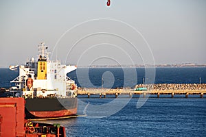 Transshipment terminal for loading steel products to sea vessels using shore cranes and special equipment in Port Pecem, Brazil,