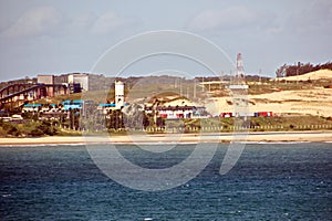 Transshipment terminal for loading steel products to sea vessels using shore cranes and special equipment in Port Pecem, Brazil,