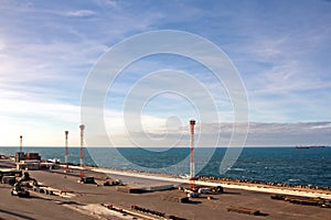 Transshipment terminal for loading steel products to sea vessels using shore cranes and special equipment in Port Pecem, Brazil,