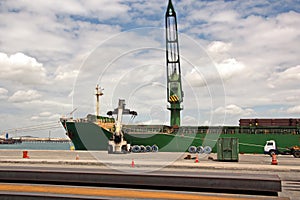 Transshipment terminal for loading steel products to sea vessels using shore cranes and special equipment in Port Pecem, Brazil,