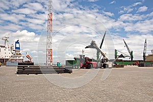 Transshipment terminal for loading steel products to sea vessels using shore cranes and special equipment in Port Pecem, Brazil,