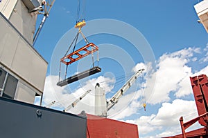 Transshipment terminal for loading steel products to sea vessels using shore cranes and special equipment in Port Pecem, Brazil,