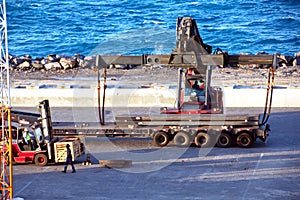 Transshipment terminal for loading steel products to sea vessels using shore cranes and special equipment in Port Pecem, Brazil,