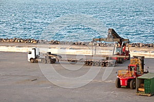 Transshipment terminal for loading steel products to sea vessels using shore cranes and special equipment in Port Pecem, Brazil,