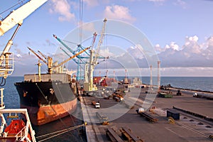 Transshipment terminal for loading steel products to sea vessels using shore cranes and special equipment in Port Pecem, Brazil,