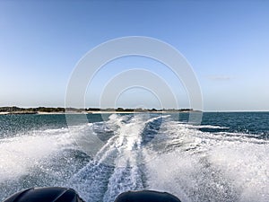 The transverse waves behind a speeding motorboat