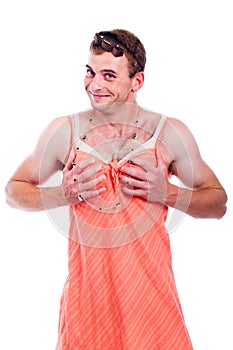 Transvestite holding his breasts photo
