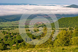Transylvania aerial view with morning mist in Covasna county near Saint Ana Lake