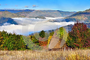 Transylvania landscape in autumn time with low clouds and frost in the morning Romania