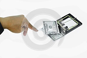 Trap with dollar bills isolated over white background, Risk in business, Businessman taking money from a mousetrap