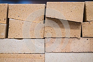 Trapezoidal refractory brick fireclay. It is used for laying stoves and fireplaces in places of direct contact with open fire. photo