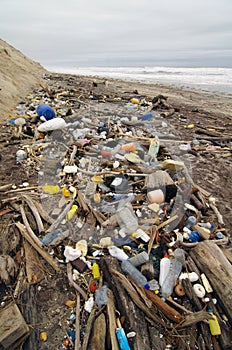 Trash beach pollution with plastics