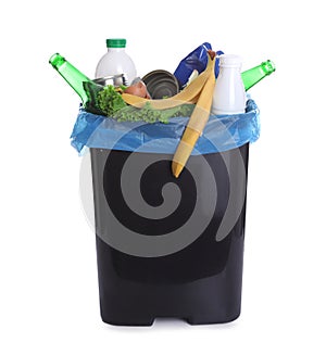 Trash bin full of garbage on white background. Recycling rubbish