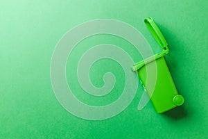 Trash bin. Green dustbin for recycle glass can trash isolated on green background. Container for disposal garbage waste and save