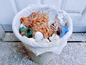 Trash bin with household-waste wastebin garbage pail litterbasket trashbarrel wastebin  dustbin  image picture stock photo photo