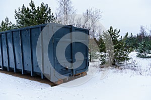 Trash bin at the side of street in winter