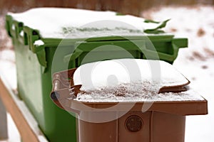 Trash bin with snow