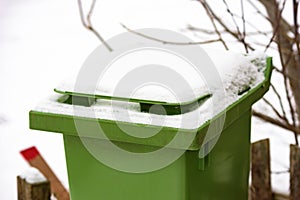 Trash bin with snow