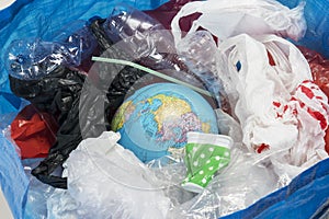 Trash bin with world globe