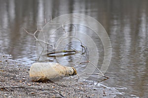 Trash bottle on the beach