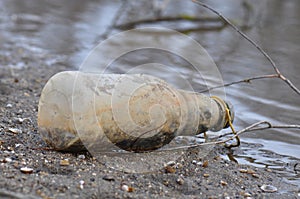 Trash bottle on the beach