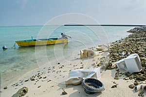 Trash and broken toilets on the tropical beach