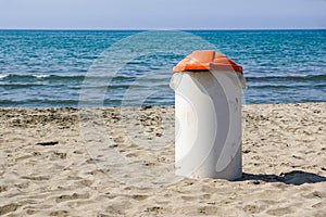 Trash can on the beach sunny day. Concept photo of a clean beach