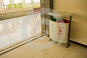 Trash can or box with organic and non- on pondok cina station in depok java indonesia