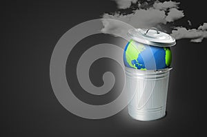 Trash can with the planet earth and smog pollution