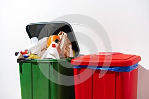 Trash cans full of waste in the building