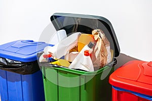 Trash cans full of waste in the building