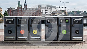 Trash containers for different rubbish in the center of Stockholm, Sweden. Waste collection in Europe for subsequent recycling,