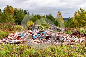 Trash landfill garbage pile in the agriculture field. Ecology pollution environment contamination problem concept