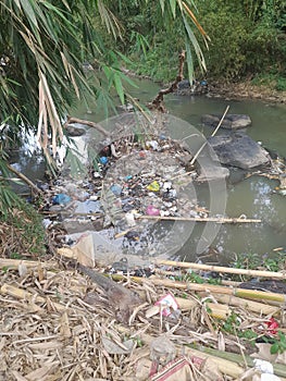 Trash piles up as the river dries up