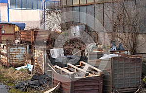 Trash placed in old rusty metal crates