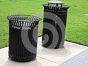 Trash receptacles installed on a cemetery to discard flower vases and trash