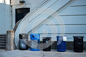 Trash and reclying cans lined up next to stairwell in Chicago Loop riverwalk park photo