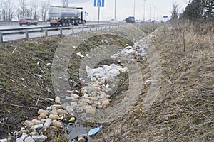 Trash in a roadside ditch