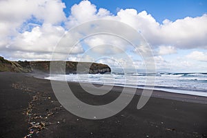 Trash in the sand, plastic waste by the ocean, sad and unsustainable photo