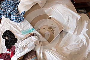 Trashed hotel room bed