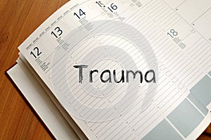 Trauma write on notebook photo