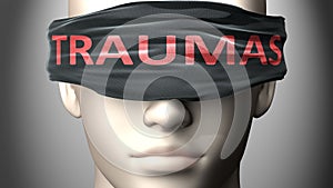 Traumas can make things harder to see or makes us blind to the reality - pictured as word Traumas on a blindfold to symbolize