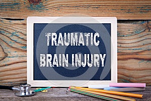 Traumatic brain injury. Chalkboard on a wooden background