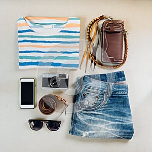 Travel accessories. Sweaters, jeans, cellphone, belts, wallets,