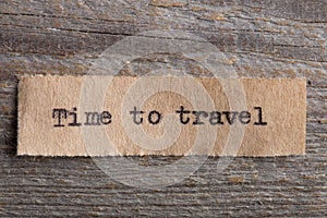 Travel and adventure concept, time to travel text on a piece of paper printed on vintage typewriter