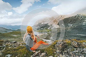 Travel adventure in mountains globetrotter woman sitting alone outdoor active vacations healthy lifestyle